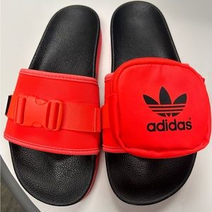 Orange Adidas slides.